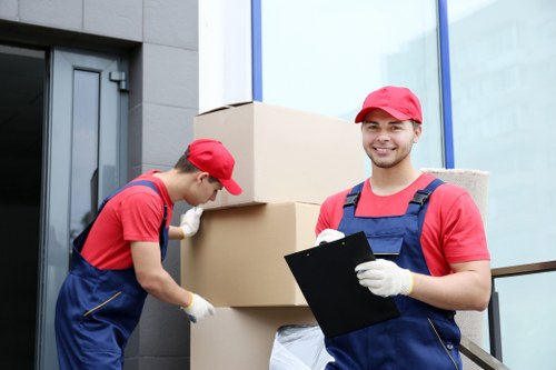 Professional movers handling furniture