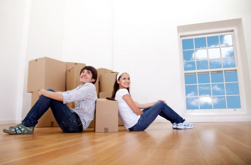 Team of professional movers handling a move in Storage Colliers Wood