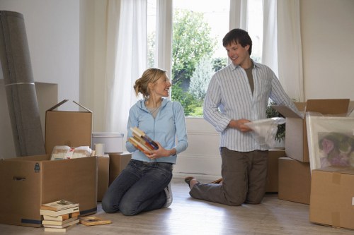 Professional moving service in action with Colliers Wood backdrop